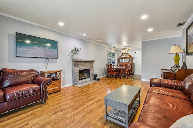 548 Bass Dr, Vacaville, CA 95687 - living area with light wood-type flooring, crown molding, recessed lighting, a ceiling fan, and baseboards