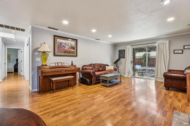 548 Bass Dr, Vacaville, CA 95687 - living area with ornamental molding, light wood-type flooring, recessed lighting, and baseboards