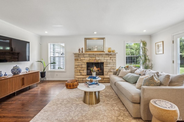 9724 Green Valley Rd, Sebastopol, CA 95472 - living area with wood finished floors, a stone fireplace, ornamental molding, recessed lighting, and baseboards