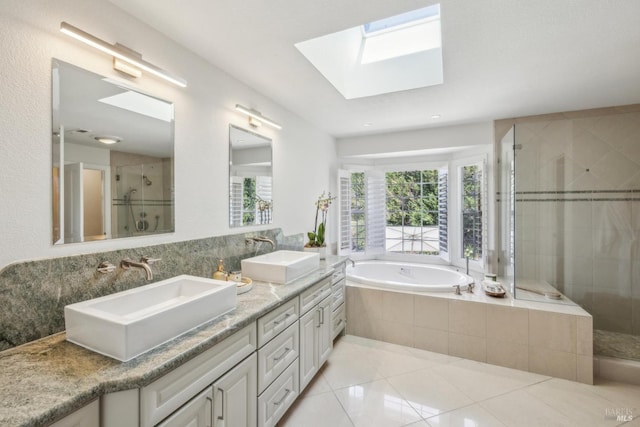 9724 Green Valley Rd, Sebastopol, CA 95472 - full bathroom with a stall shower, a skylight, tile patterned floors, a garden tub, and double vanity
