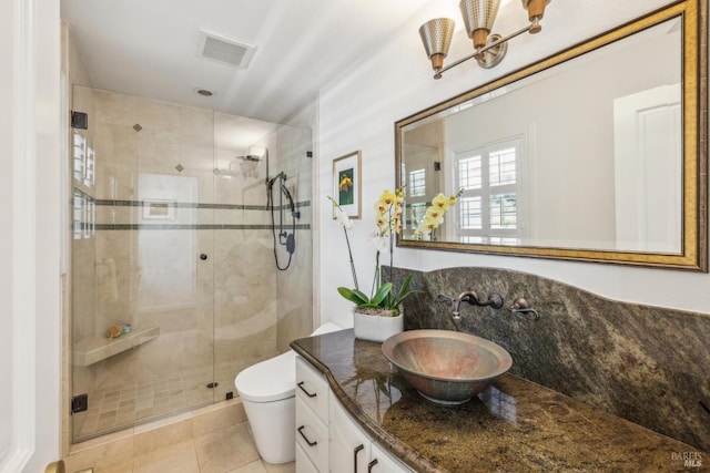 9724 Green Valley Rd, Sebastopol, CA 95472 - bathroom with vanity, toilet, a stall shower, a chandelier, and tile patterned floors