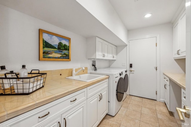 9724 Green Valley Rd, Sebastopol, CA 95472 - washroom featuring cabinet space, washer and dryer, recessed lighting, and light tile patterned flooring