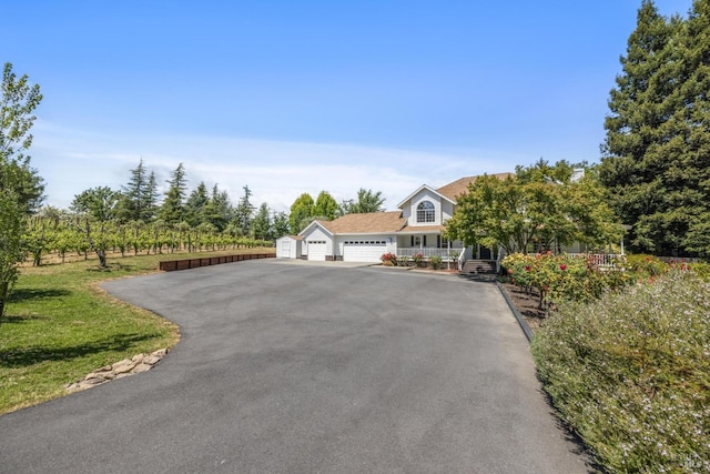 9724 Green Valley Rd, Sebastopol, CA 95472 - view of front of property with a garage, asphalt driveway, and a porch