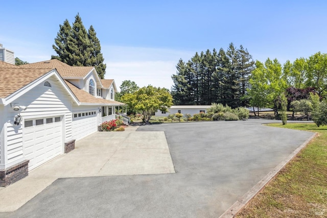 9724 Green Valley Rd, Sebastopol, CA 95472 - view of front of home with driveway, roof with shingles, and a garage