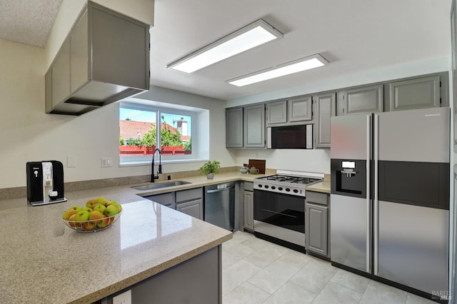 181 Belvedere Ct, Vallejo, CA 94589 - kitchen with stainless steel appliances, a sink, gray cabinets, light stone counters, and light tile patterned floors