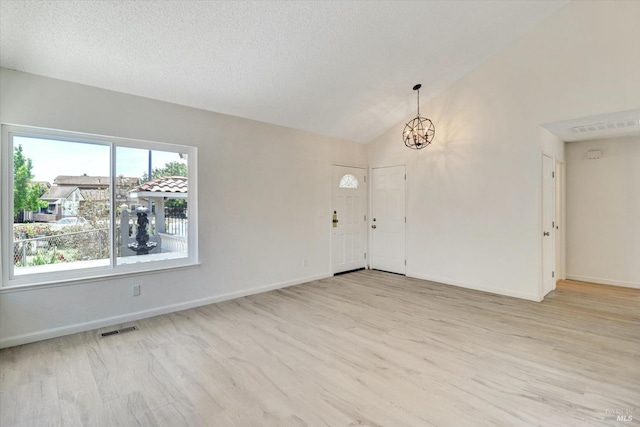 181 Belvedere Ct, Vallejo, CA 94589 - entryway featuring a chandelier, light wood-style flooring, lofted ceiling, and baseboards