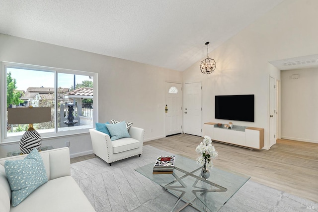 181 Belvedere Ct, Vallejo, CA 94589 - living room featuring wood finished floors, a chandelier, baseboards, and vaulted ceiling