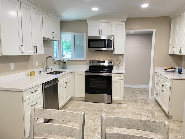 312 Dahlia St, Fairfield, CA 94533 - kitchen featuring appliances with stainless steel finishes, a sink, white cabinetry, light countertops, and recessed lighting