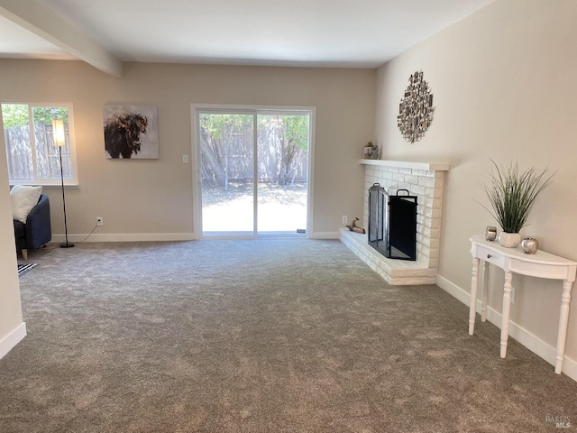 312 Dahlia St, Fairfield, CA 94533 - unfurnished living room with carpet, a brick fireplace, beam ceiling, and baseboards
