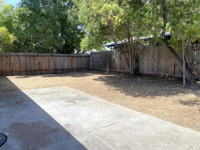 312 Dahlia St, Fairfield, CA 94533 - fenced backyard with a patio area