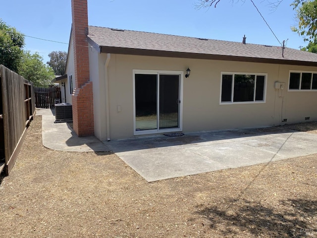 312 Dahlia St, Fairfield, CA 94533 - rear view of house with cooling unit, a patio area, roof with shingles, and a chimney