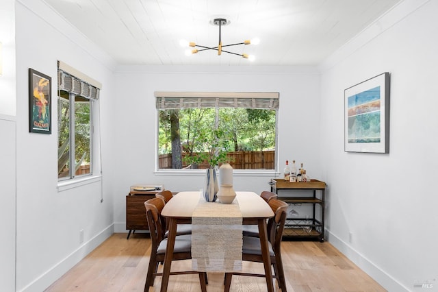 4512 Dry Creek Rd, Napa, CA 94558 - dining space with crown molding, a chandelier, light wood finished floors, and baseboards