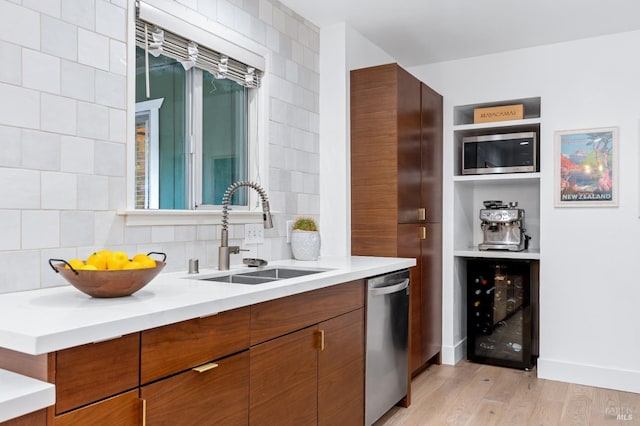 4512 Dry Creek Rd, Napa, CA 94558 - kitchen featuring stainless steel appliances, a sink, wine cooler, decorative backsplash, and light wood-style flooring