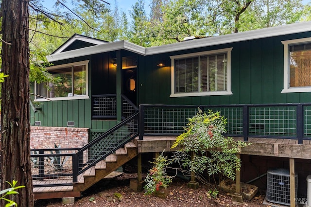 4512 Dry Creek Rd, Napa, CA 94558 - view of front of house featuring board and batten siding, stairway, and central AC unit