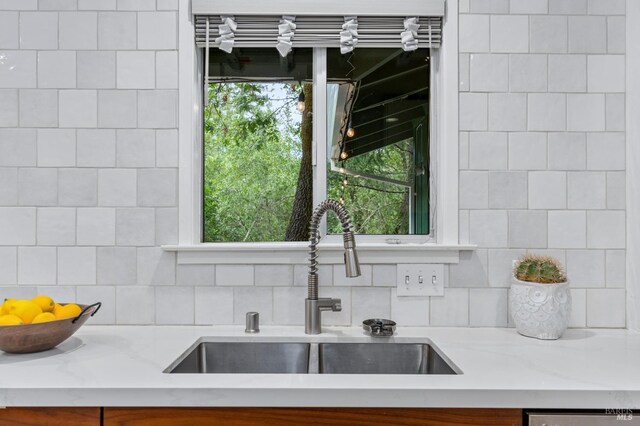 4512 Dry Creek Rd, Napa, CA 94558 - kitchen featuring a sink, decorative backsplash, light stone counters, and dishwashing machine