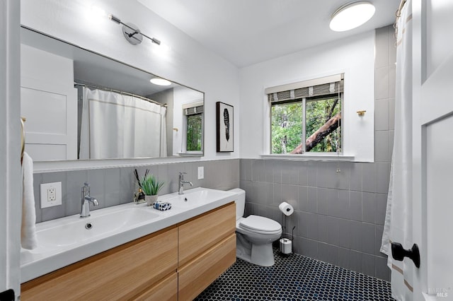 4512 Dry Creek Rd, Napa, CA 94558 - bathroom with tile walls, toilet, double vanity, curtained shower, and tile patterned flooring