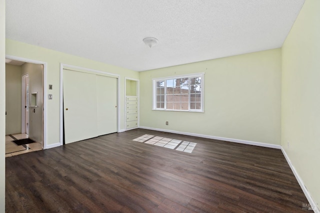 4335 Bodega Ave, Petaluma, CA 95942 - unfurnished bedroom with wood finished floors, baseboards, a textured ceiling, and a closet