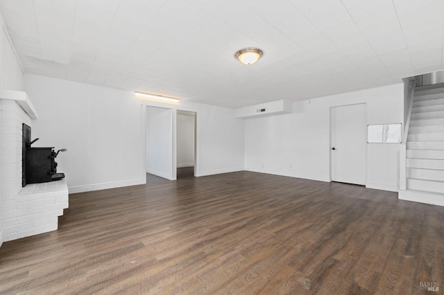 4335 Bodega Ave, Petaluma, CA 95942 - unfurnished living room featuring stairway, dark wood finished floors, baseboards, and a fireplace