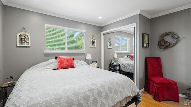 1295 Marian Way, Petaluma, CA 94954 - bedroom featuring multiple windows, light wood-style flooring, baseboards, a closet, and crown molding