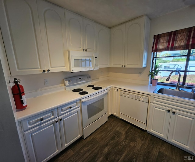 2145 Clearview Cir, Benicia, CA 94510 - kitchen with white appliances, a sink, dark wood-style floors, and white cabinetry