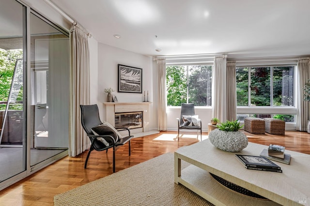 600 Deer Valley Rd Unit 1E, San Rafael, CA 94903 - living area with light wood finished floors, a glass covered fireplace, and recessed lighting