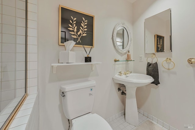 600 Deer Valley Rd Unit 1E, San Rafael, CA 94903 - bathroom with toilet, tile patterned floors, and baseboards