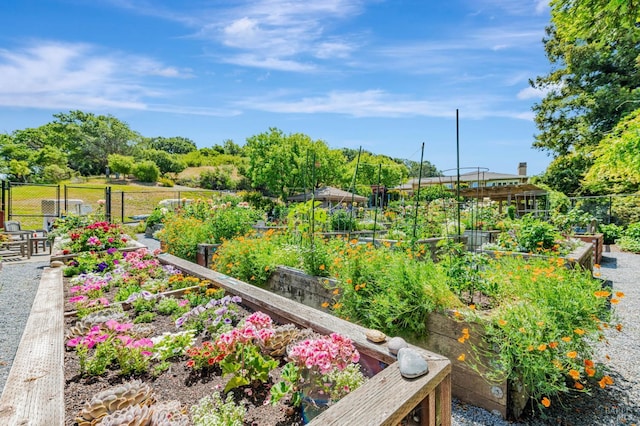 600 Deer Valley Rd Unit 1E, San Rafael, CA 94903 - view of yard featuring a vegetable garden and fence