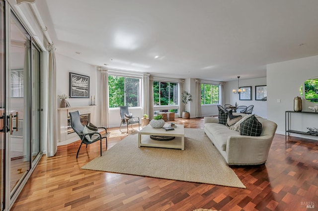600 Deer Valley Rd Unit 1E, San Rafael, CA 94903 - living area with light wood-style floors and a chandelier