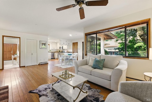 4620 Morris Ct, Santa Rosa, CA 95405 - living area with light wood-style floors, a ceiling fan, a baseboard heating unit, and baseboard heating