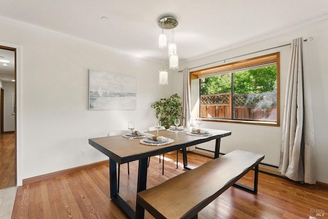 4620 Morris Ct, Santa Rosa, CA 95405 - dining area featuring crown molding, wood finished floors, a baseboard heating unit, and baseboards