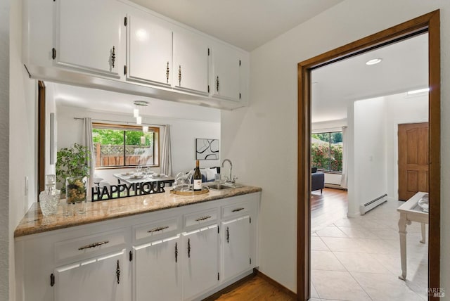 4620 Morris Ct, Santa Rosa, CA 95405 - bar area featuring baseboard heating, healthy amount of natural light, a sink, and light tile patterned floors