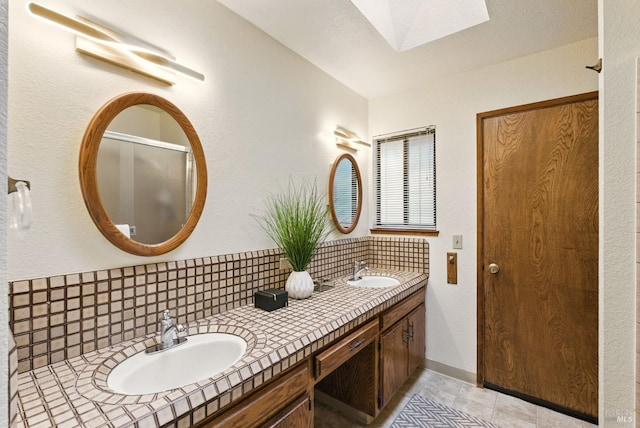 4620 Morris Ct, Santa Rosa, CA 95405 - full bath featuring backsplash, double vanity, and a skylight