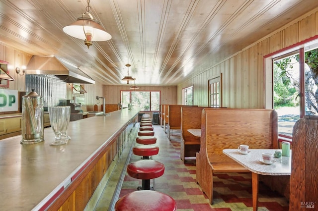 4100 Petrified Forest Rd, Santa Rosa, CA 94515 - dining area featuring tile patterned floors, wood ceiling, and wood walls