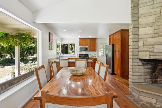 4100 Petrified Forest Rd, Santa Rosa, CA 94515 - dining room with dark wood finished floors, a stone fireplace, recessed lighting, and lofted ceiling