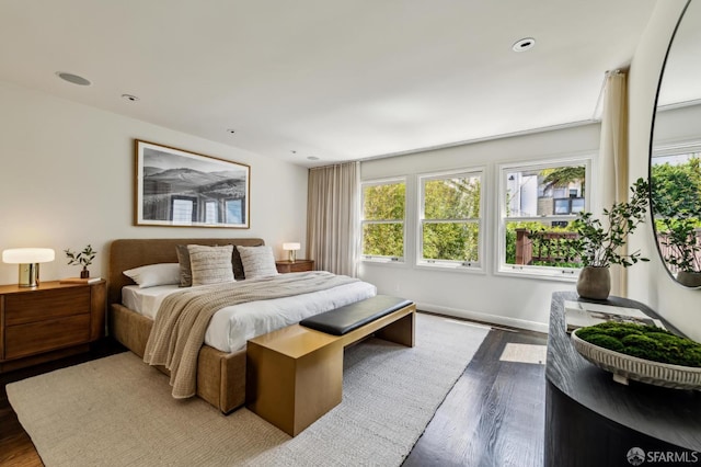 2111 Vallejo St, San Francisco, CA 94123 - bedroom with multiple windows, dark wood-type flooring, recessed lighting, and baseboards