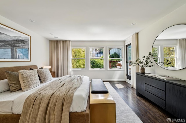 2111 Vallejo St, San Francisco, CA 94123 - bedroom with dark wood finished floors, multiple windows, and recessed lighting