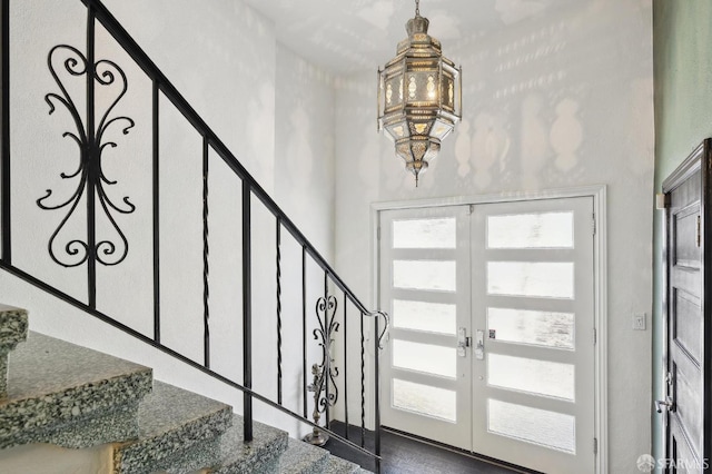 2111 Vallejo St, San Francisco, CA 94123 - entryway featuring french doors, a chandelier, stairway, and a high ceiling