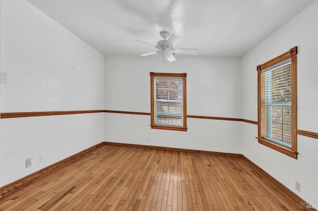 845 W K St, Benicia, CA 94510 - empty room with plenty of natural light, a ceiling fan, light wood-style flooring, and baseboards