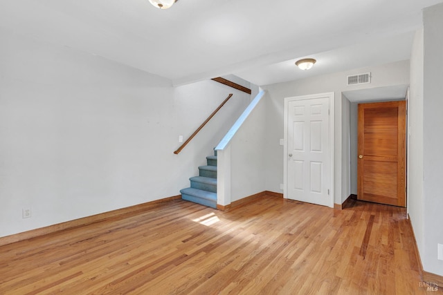 845 W K St, Benicia, CA 94510 - unfurnished living room with light wood finished floors, stairway, and baseboards