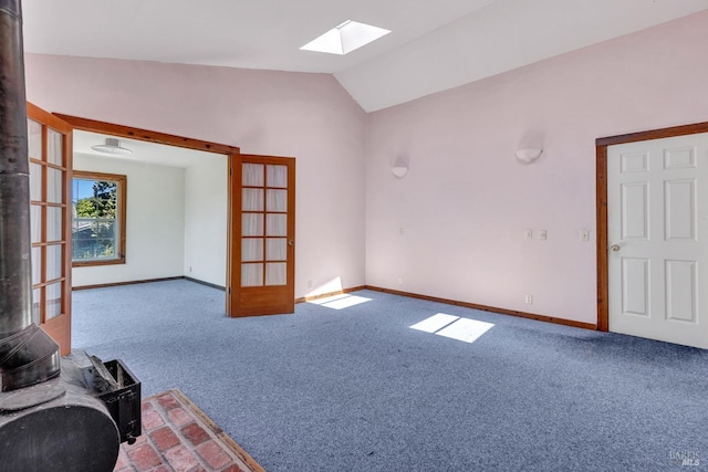 845 W K St, Benicia, CA 94510 - unfurnished living room with a skylight, vaulted ceiling, carpet, and baseboards