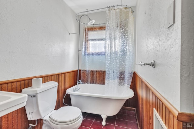 845 W K St, Benicia, CA 94510 - full bath featuring wainscoting, toilet, a freestanding tub, a textured wall, and wood walls