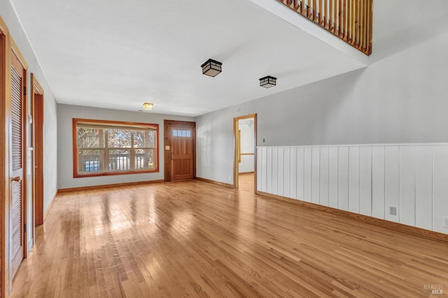 845 W K St, Benicia, CA 94510 - unfurnished room featuring wood finished floors, a wainscoted wall, and baseboards