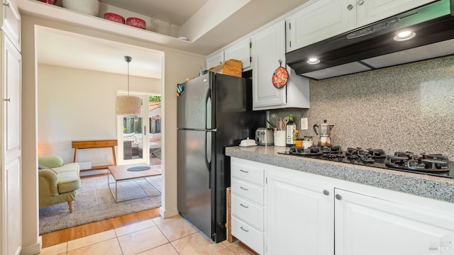 9 Endeavor Cv, Corte Madera, CA 94925 - kitchen featuring under cabinet range hood, light countertops, backsplash, black appliances, and white cabinetry