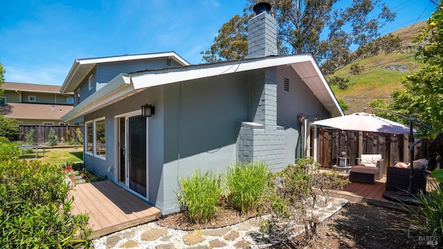 9 Endeavor Cv, Corte Madera, CA 94925 - view of side of home featuring a chimney, a wooden deck, and stucco siding