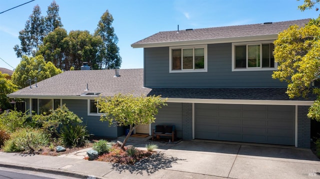9 Endeavor Cv, Corte Madera, CA 94925 - view of front facade featuring driveway, an attached garage, roof with shingles, and brick siding