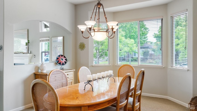 2001 Timberline Ln, Petaluma, CA 94954 - dining area with light carpet, arched walkways, baseboards, and a chandelier