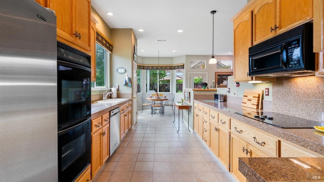 2001 Timberline Ln, Petaluma, CA 94954 - kitchen with black appliances, backsplash, light tile patterned floors, recessed lighting, and hanging light fixtures