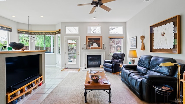 2001 Timberline Ln, Petaluma, CA 94954 - tiled living room featuring a ceiling fan, a glass covered fireplace, baseboards, and recessed lighting