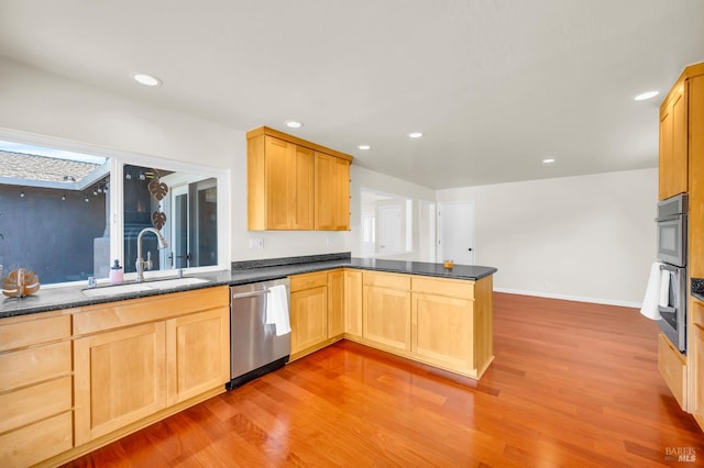 3730 Ruston Ln, Napa, CA 94558 - kitchen with appliances with stainless steel finishes, a sink, a peninsula, light wood-style floors, and recessed lighting