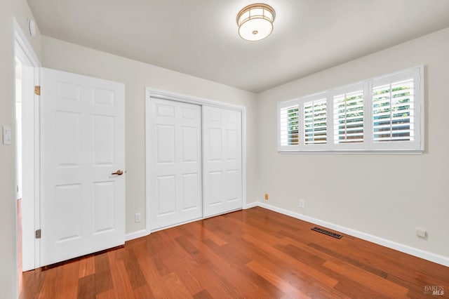3730 Ruston Ln, Napa, CA 94558 - unfurnished bedroom with wood finished floors, baseboards, and a closet
